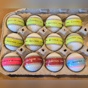 12 TaylorMade Striped golf balls. Very good to mint condition. 4A/5A.